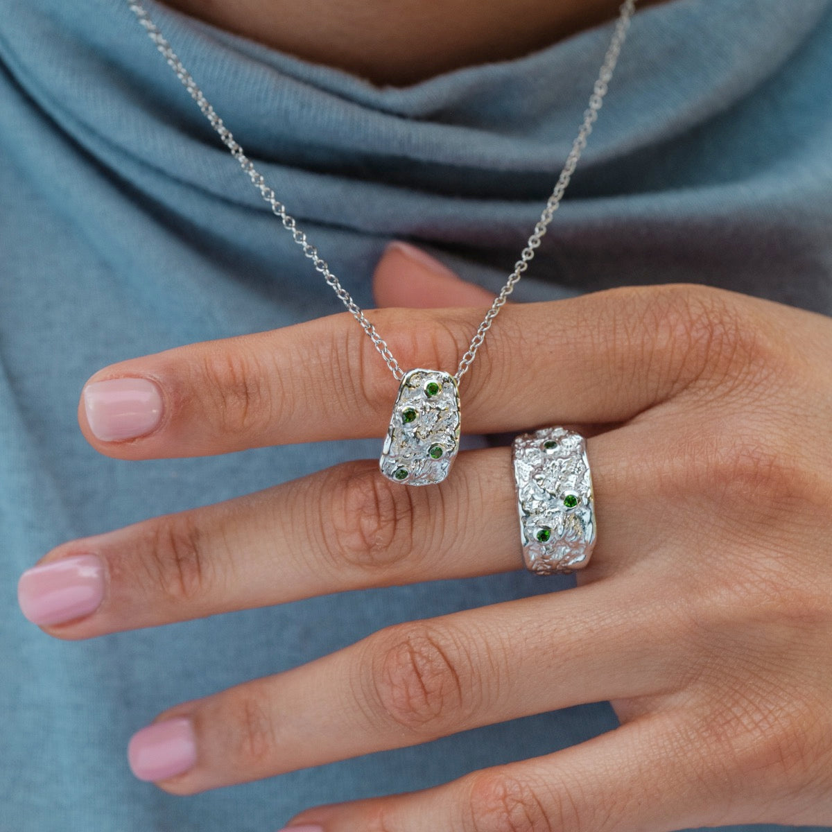 "Silverstream Necklace necklace with a silver and green diopside design, showcasing an elegant and modern style."
