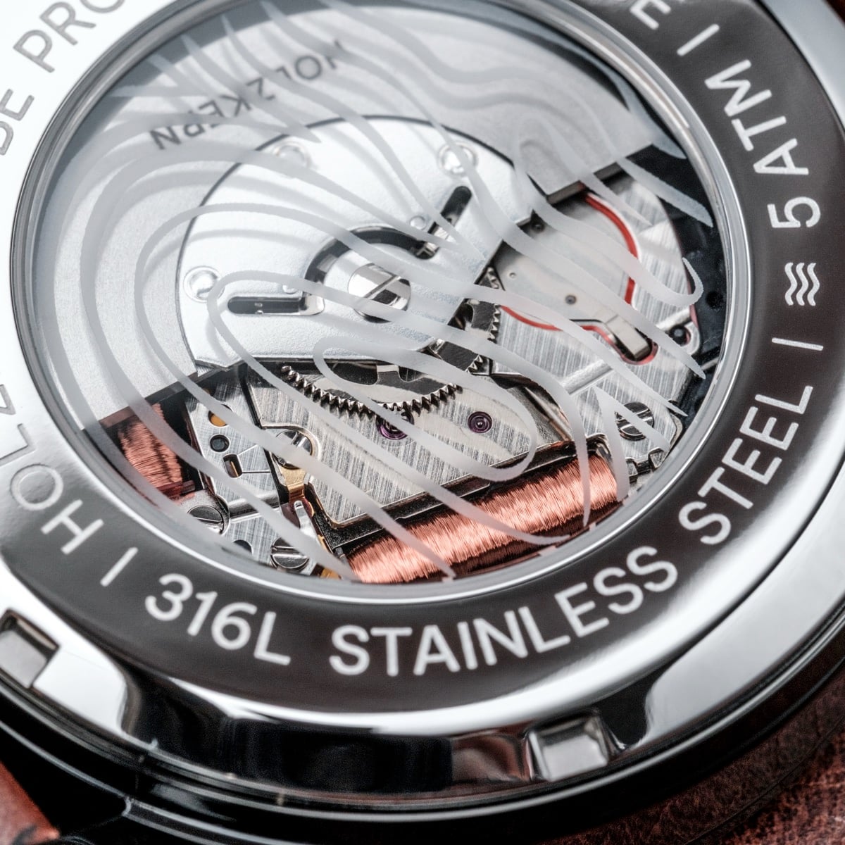 "Gmt Skywhirl" watch, showcasing intricate marble and black design elements.