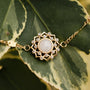 "Composition Gem Bracelet" bracelet featuring moonstone and gold, styled with a delicate and intricate design.