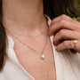 "Panoramic Necklace" necklace featuring white pearl and silver chain in a delicate, elegant style.