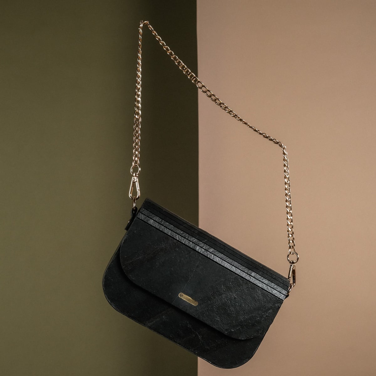"Iveya VEGAN Black Slate vegan handbag featuring a sleek black slate material with elegant gold chain strap."