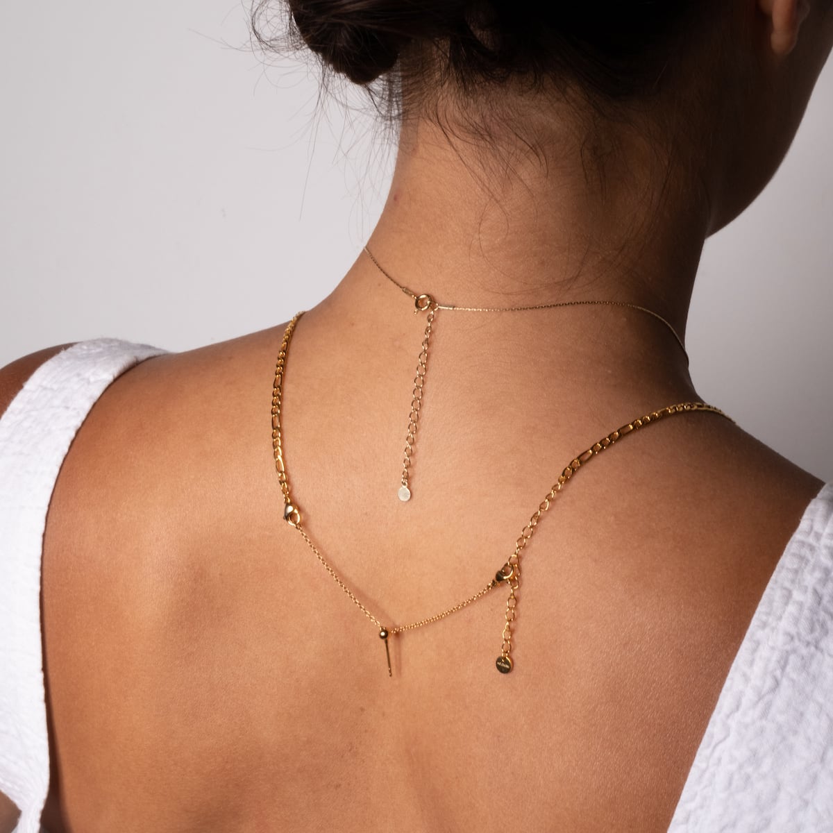 "Jewelry Extender" jewelry extender in gold, 4-8 cm, featuring a delicate and elegant design.