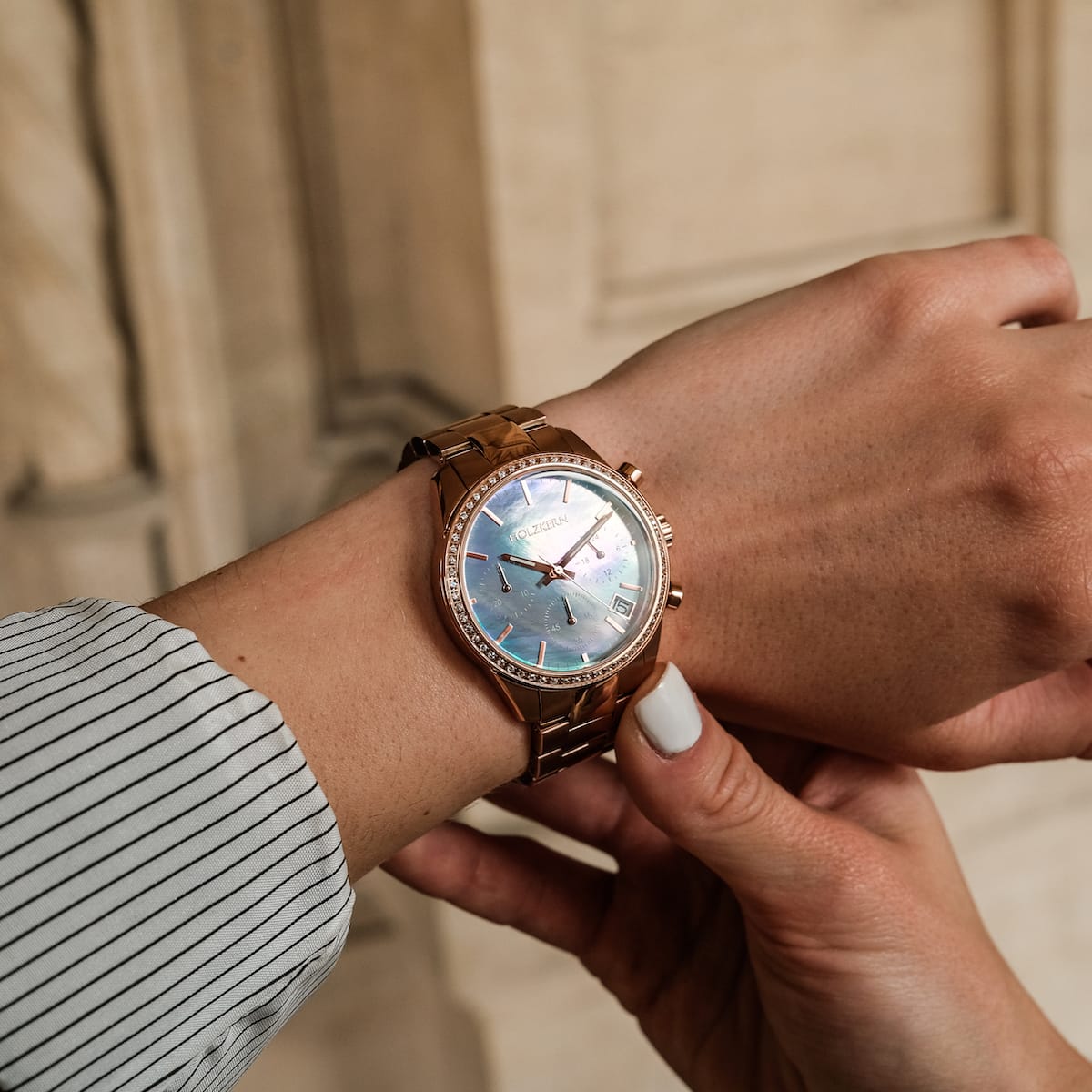"The Passionate watch with a nacre dial and rose gold case, offering an elegant and timeless style."