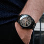 "Adrenin, elegant watch with a Cat's Eye and Walnut design, worn on the wrist."