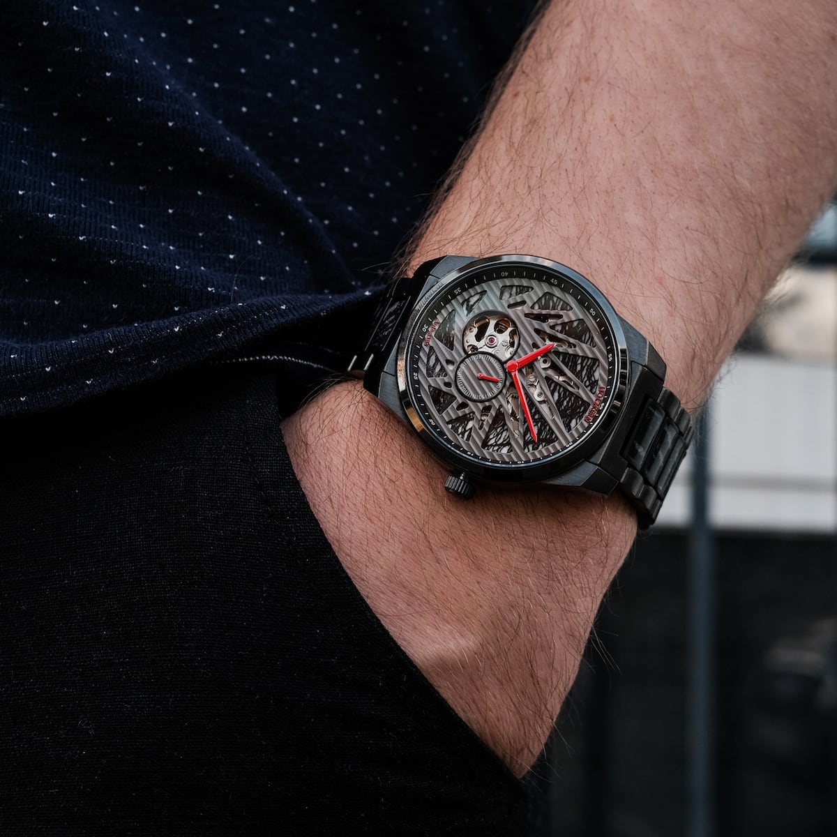 "Pacemaker wristwatch with a marble design and sleek style, featuring a detailed skeletal dial and vibrant red accents."