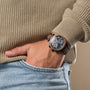 "Scattered" wristwatch featuring marble and koa design on a casual outfit.