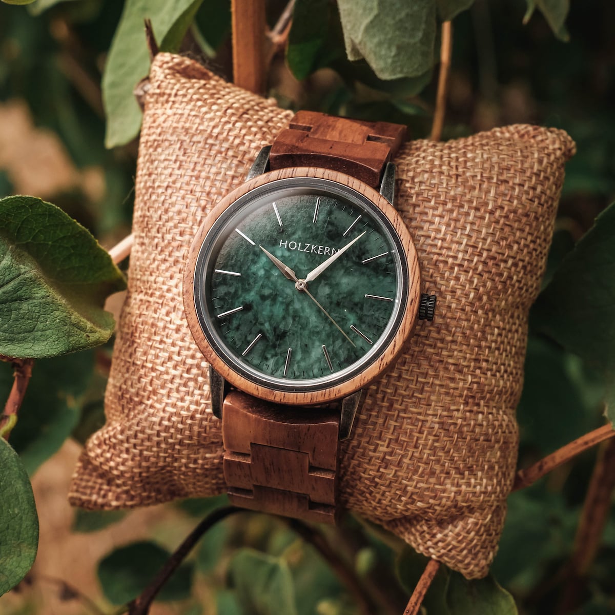 "Bob", a stylish wooden watch with a green marble dial, showcasing a blend of natural elegance and craftsmanship.
