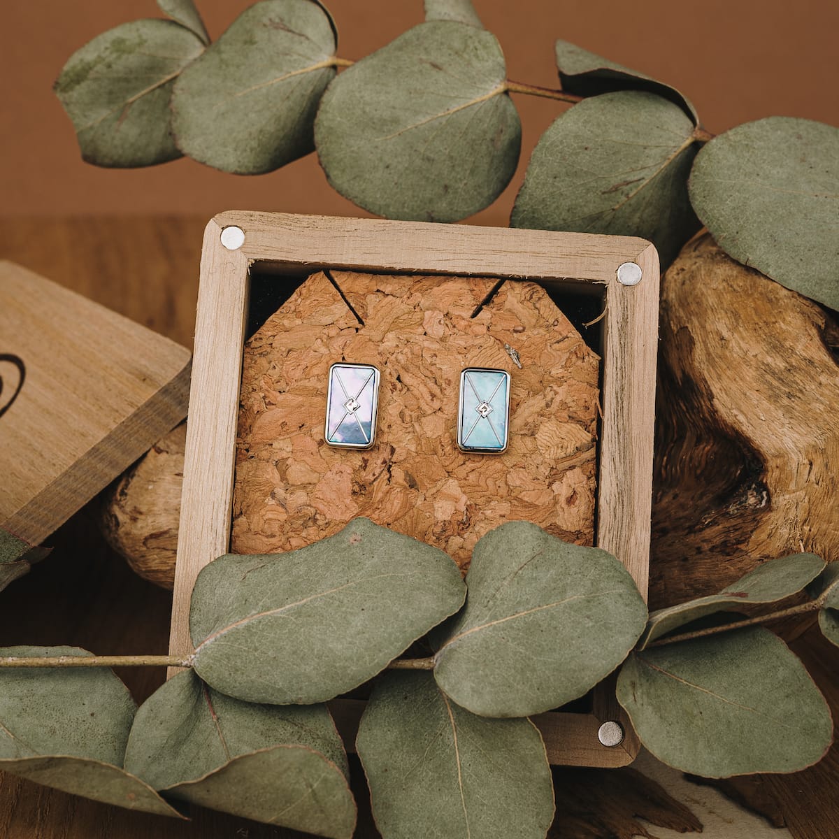 "Aquarell Earrings" earrings featuring a blue nacre and silver design in a natural, rustic style setting.