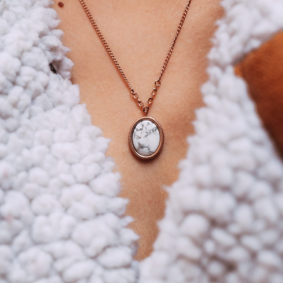 "Mirror Necklace", an elegant necklace featuring a turquoise and rose gold design with a stylish pendant.