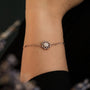 "Composition Gem Bracelet", a delicate bracelet featuring moonstone and rose gold, showcases an elegant and sophisticated design.