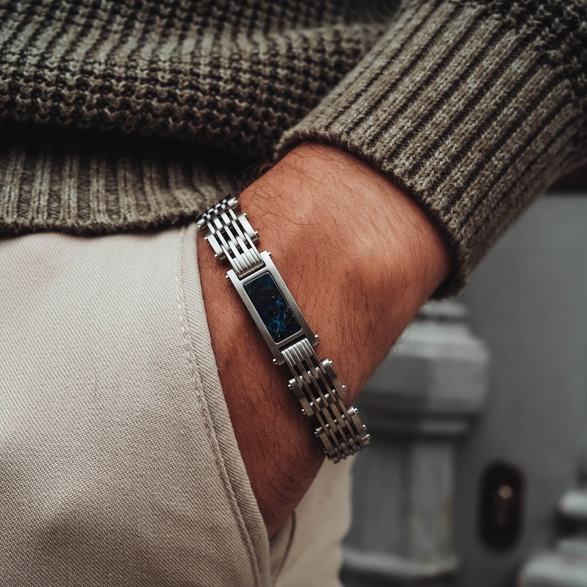 "Adagio" watch with a blue marble face and silver band, showcasing a sleek and modern design.