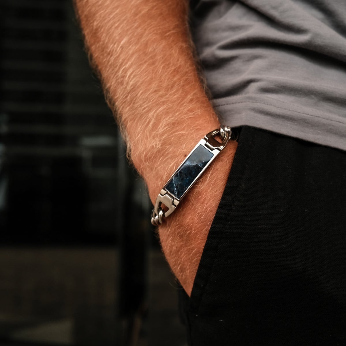 "Modulus Bracelet" bracelet features a sleek design with sodalite and silver elements, adding a sophisticated touch to any outfit.