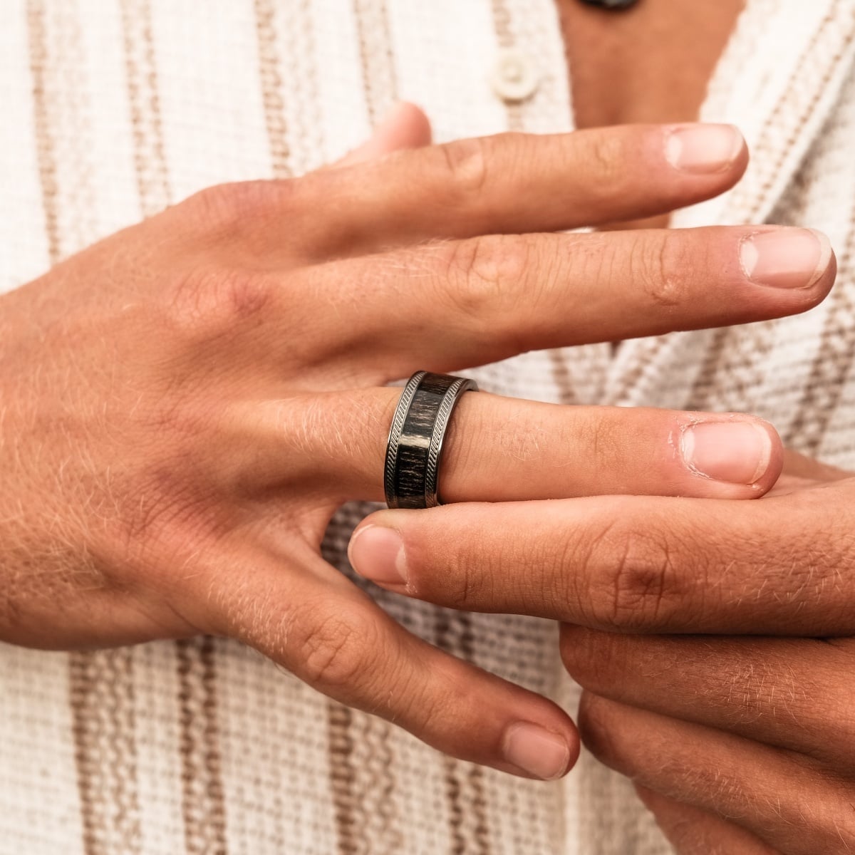 "Countless Ring" ring featuring a modern blend of maple and dark grey with a sleek finish.