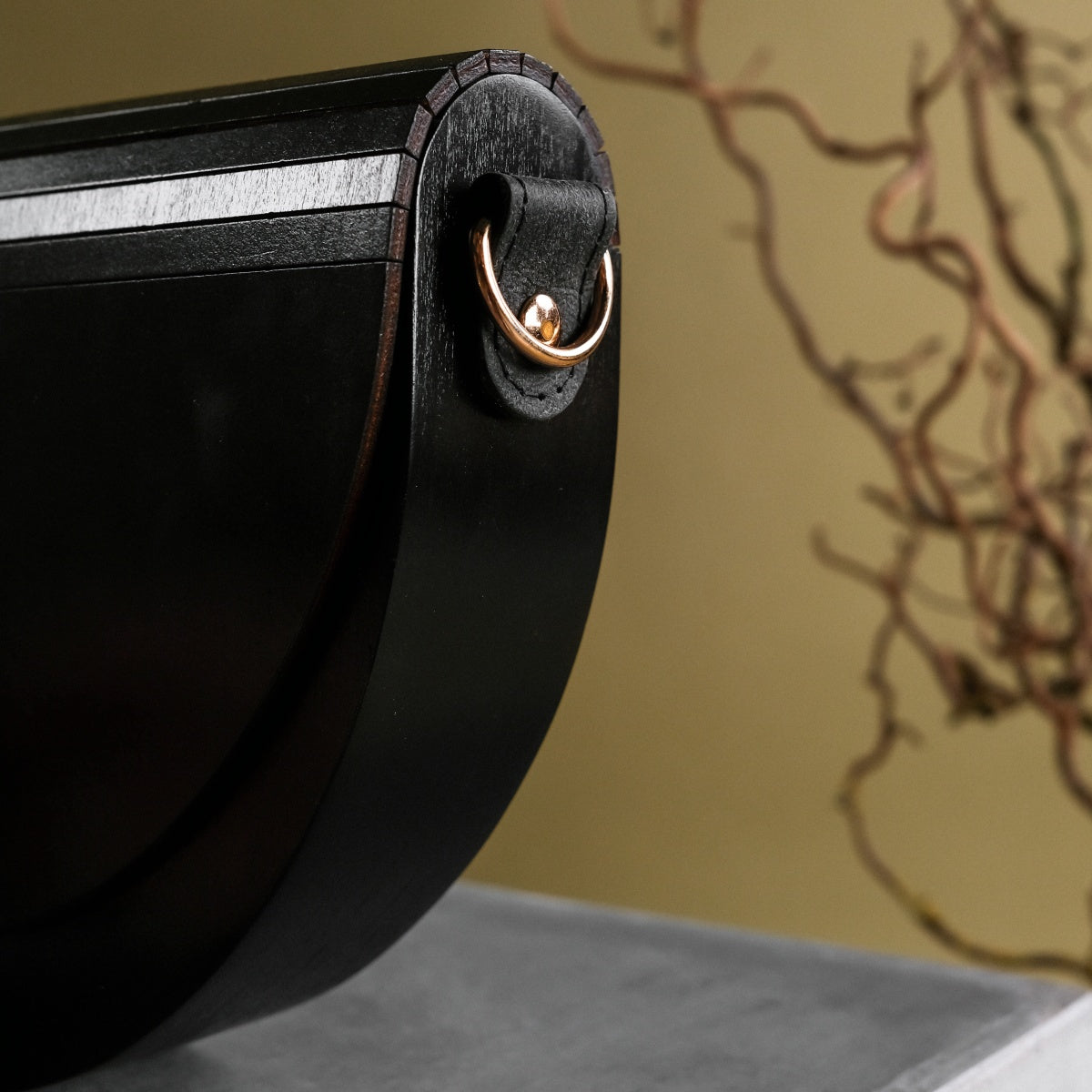 "Asumi VEGAN Black Maple" handbag featuring a sleek black design with elegant metallic accents.