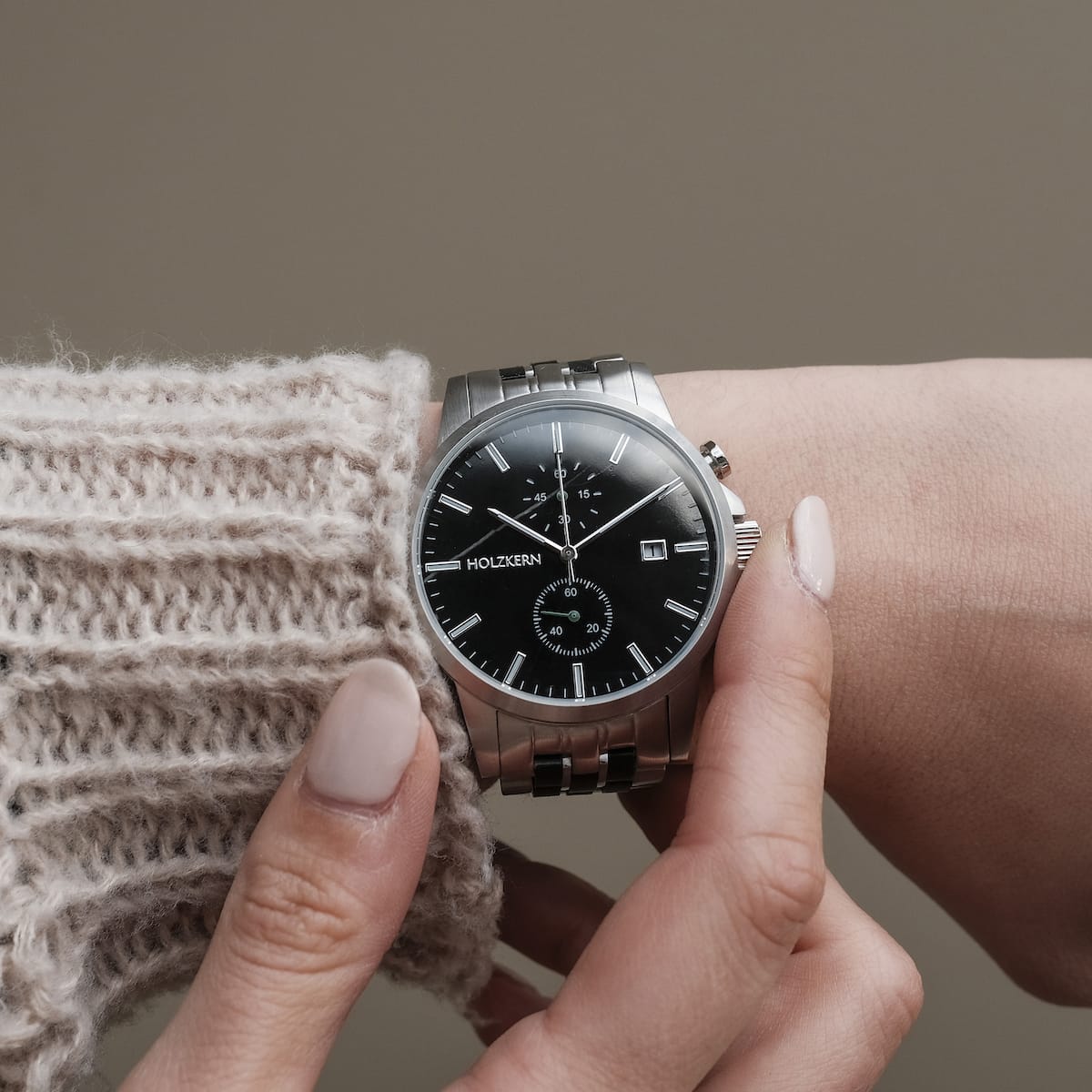 "The Observant wristwatch featuring a sleek design in maple and marble materials, with a modern, minimalistic silver-tone look."