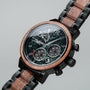 "Scattered" watch featuring a marble and koa wood design with a stylish and sophisticated chronograph face.