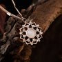 "Composition Gem Necklace", a rose gold necklace featuring a moonstone gem with intricate design, exudes elegance and style.