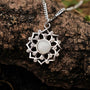 "Composition Gem Necklace": Elegant silver necklace with moonstone gem, featuring intricate geometric design.