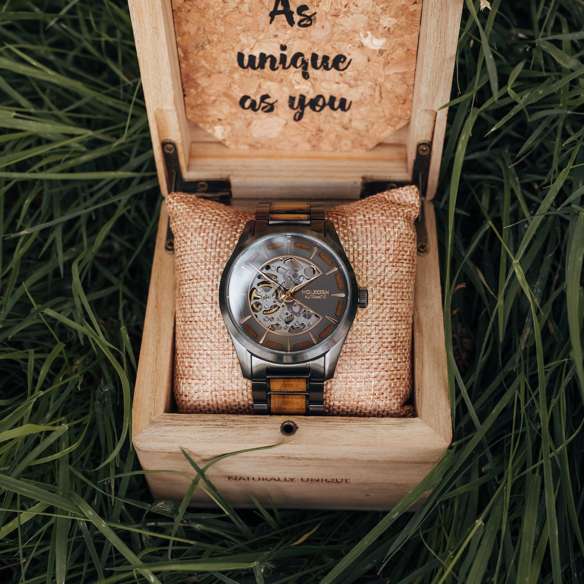 "Tenoumer" watch in koa and dark grey, featuring a unique skeleton design in a wooden box.