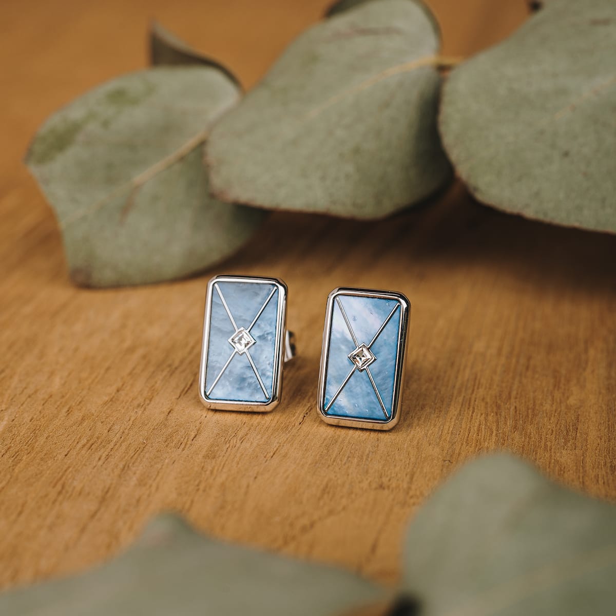 "Aquarell Earrings" earrings featuring blue nacre and silver with a geometric design.