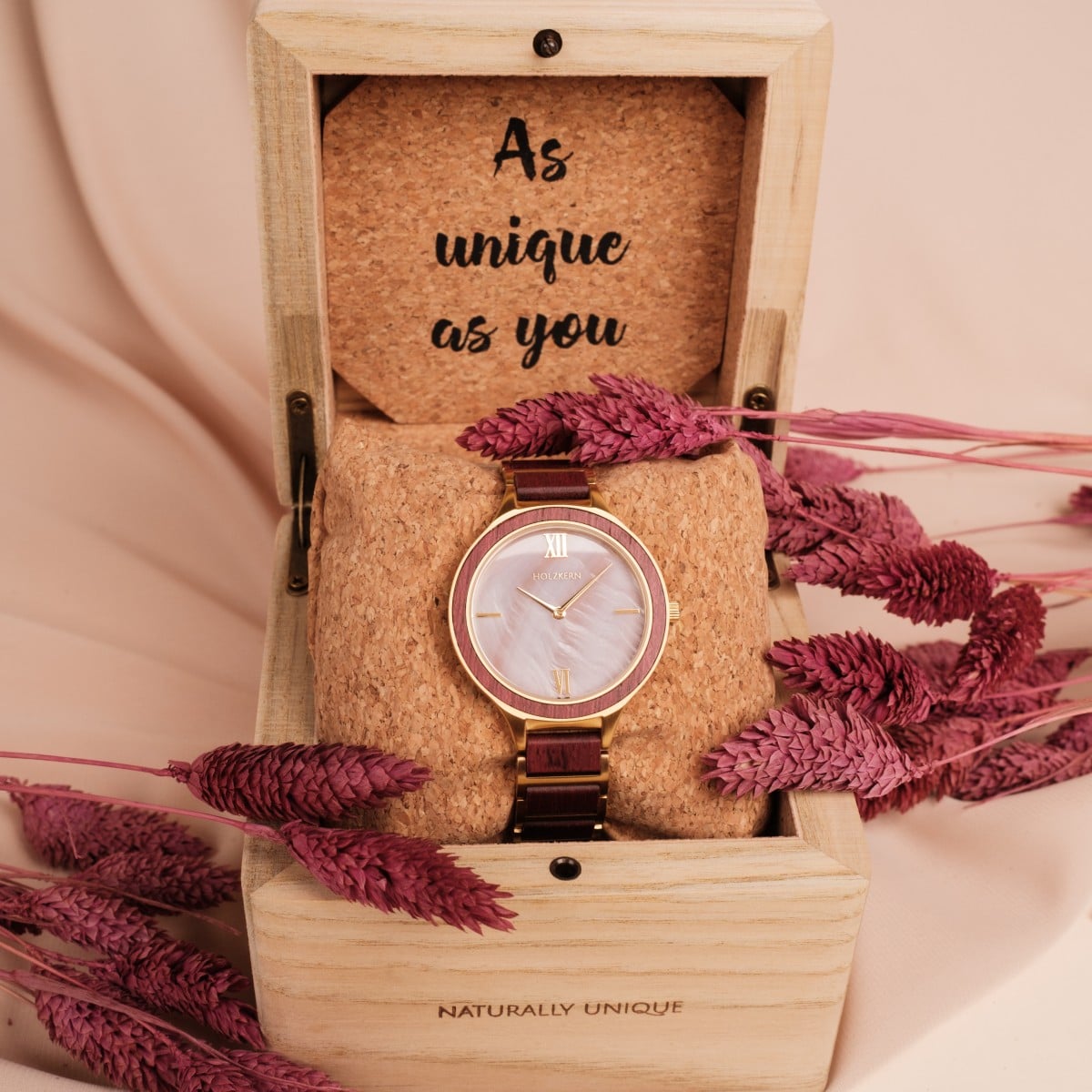 "Mauritius" watch featuring an elegant design with amaranth and nacre accents, presented in a wooden box.