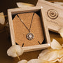 "Composition Gem Necklace", rose gold necklace with moonstone, featuring an intricate geometric design.