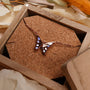 "Fritillary Necklace", a butterfly-inspired necklace, features nacre and rose gold for an elegant, natural aesthetic.