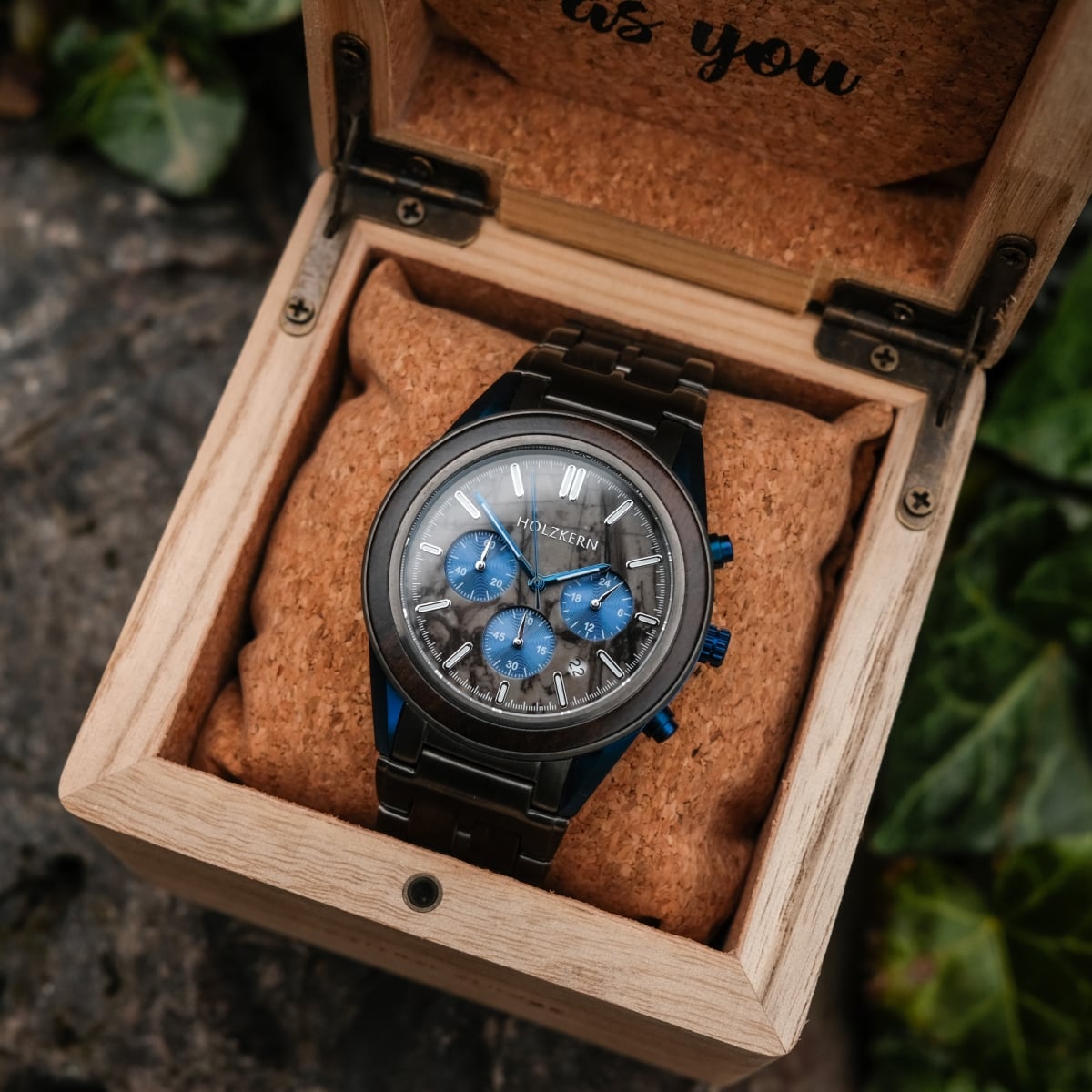 "Intergalactic watch features leadwood and marble design, nestled in a wooden box for an elegant look."