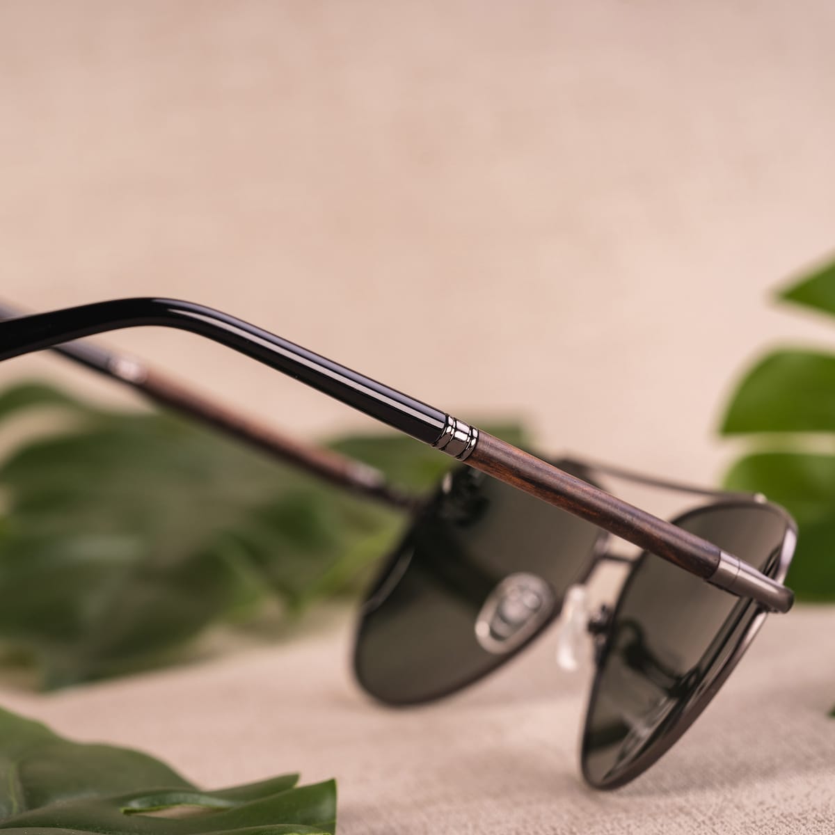 "The Badass II" sunglasses featuring an elegant Leadwood and Antique Silver design, highlighting a sleek and natural style.