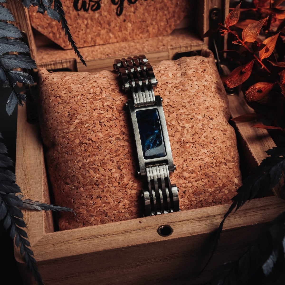 "Adagio" watch featuring a blue marble face and silver band, elegantly presented in a rustic wooden box.