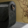 "Iveya VEGAN Black Slate, a vegan leather bag with a sleek black slate aesthetic, featuring a unique texture and elegant design."