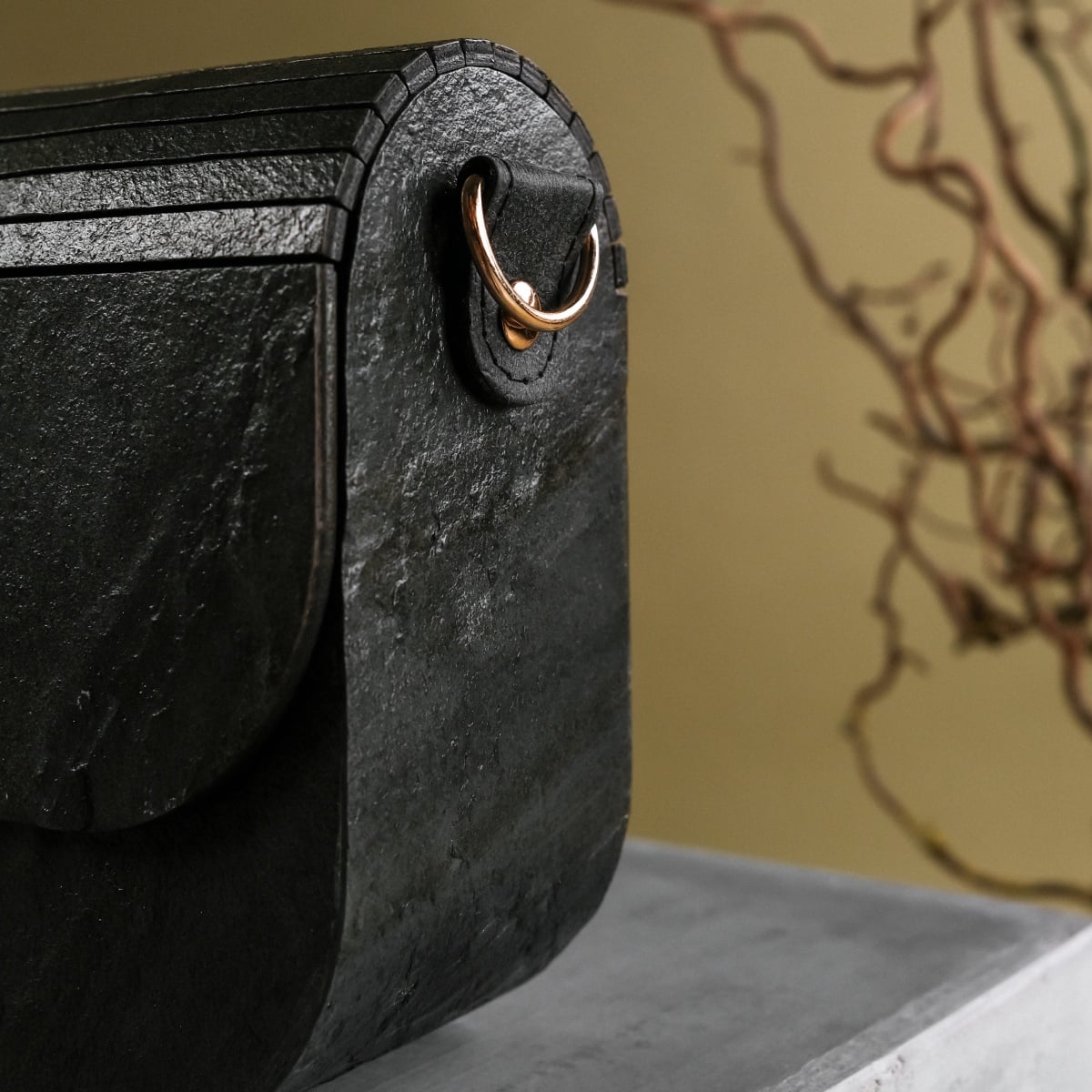 "Iveya VEGAN Black Slate, a vegan leather bag with a sleek black slate aesthetic, featuring a unique texture and elegant design."