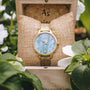 "Talamanca", elegante orologio con tonalità di grigio e oro con un design sofisticato.