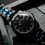 Orologio "Glaciersurge" con un design elegante e moderno con un quadrante nero e elementi in acciaio inox.