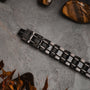 Bracciale "Tremolo" in acero e grigio scuro, con un design elegante e moderno.