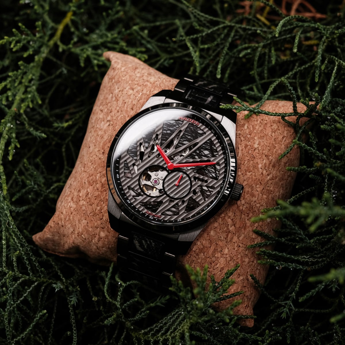 "Pacemaker watch with a marble/marble design featuring a striking geometric pattern and vibrant red accents."