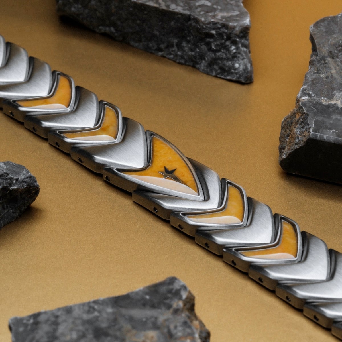 "Command" bracelet with jade and silver accents, featuring a sleek, angular design.