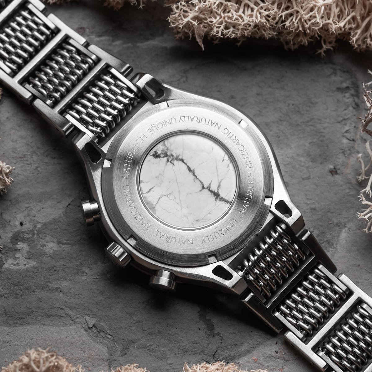 "Elqui", a stylish watch with a marble face and silver-tone accents, showcasing intricate detailing and elegance.