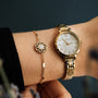 "Composition Gem Bracelet" bracelet features gold and moonstone with a delicate, elegant design.