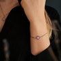 "Composition Gem Bracelet", a delicate moonstone and rose gold bracelet, exudes elegance and sophistication.