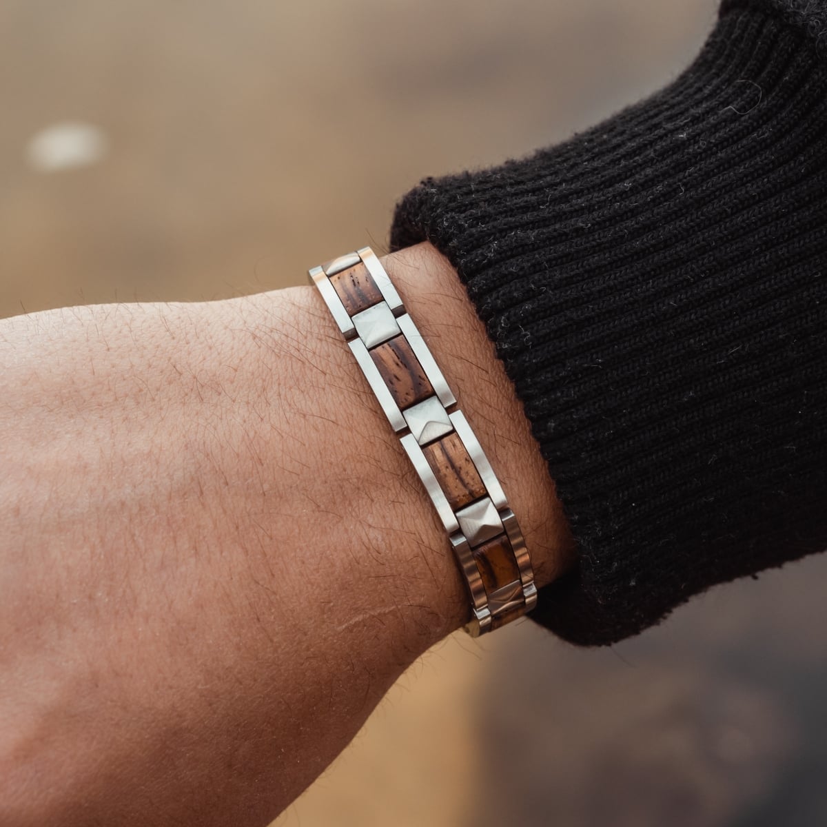 "Rhapsody" bracelet with zebrawood and silver accents, showcasing a sleek and stylish design.