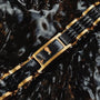 "Adagio" bracelet featuring a striking marble and gold design with a luxurious style.