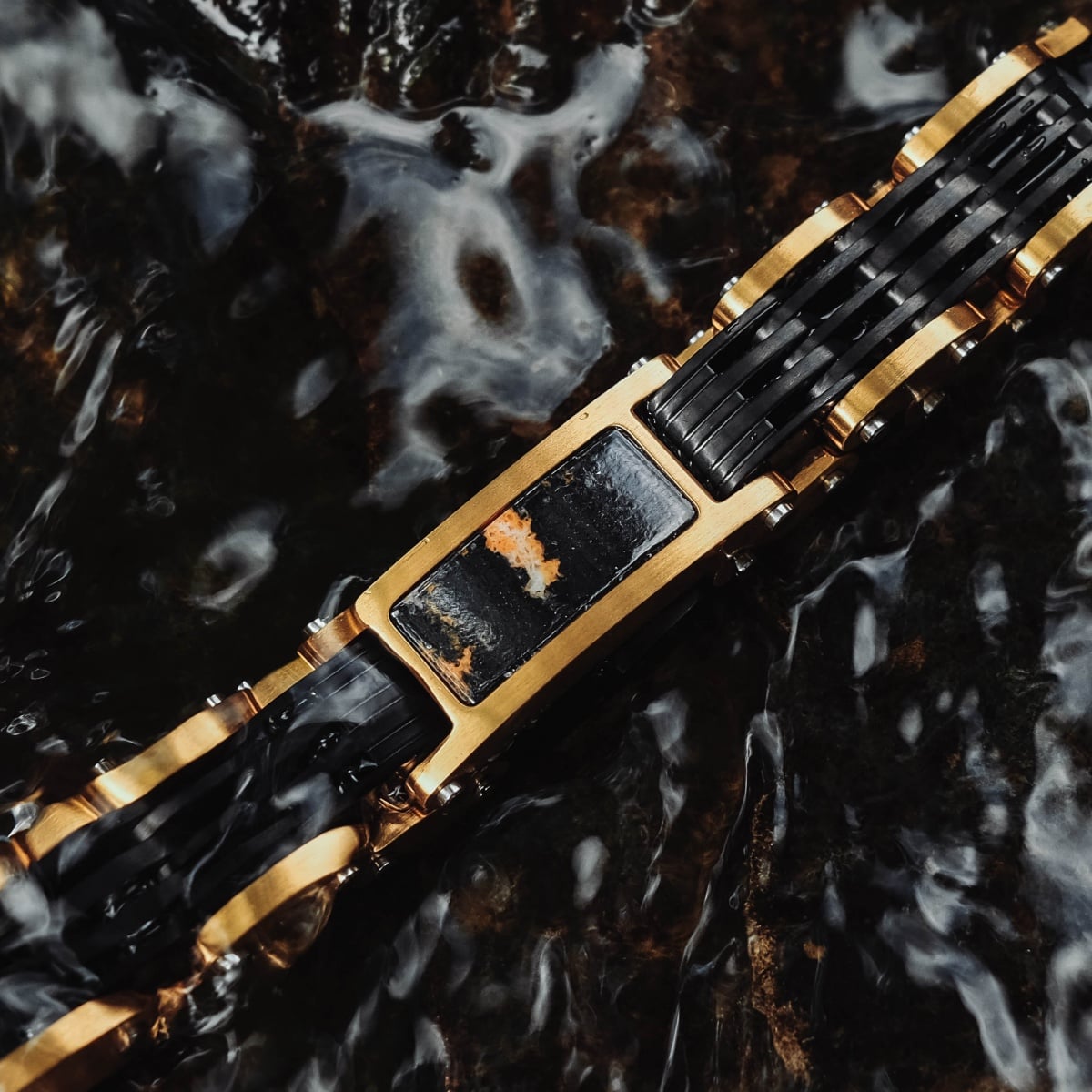 "Adagio" bracelet featuring a striking marble and gold design with a luxurious style.