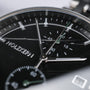 "The Observant watch featuring a sleek maple and marble design with a modern aesthetic."