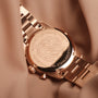 "The Passionate, a wristwatch with rose gold tones, featuring a nacre finish and elegant design elements."