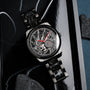 "Pacemaker watch featuring marble design and sleek black elements."