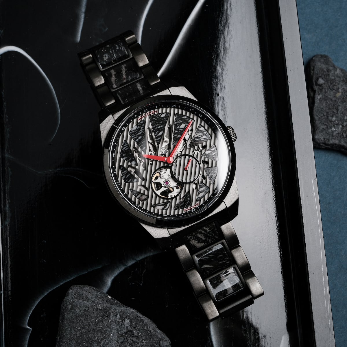 "Pacemaker watch featuring marble design and sleek black elements."