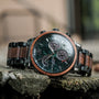 "Scattered" watch with marble and koa materials, featuring a sleek, sophisticated design.