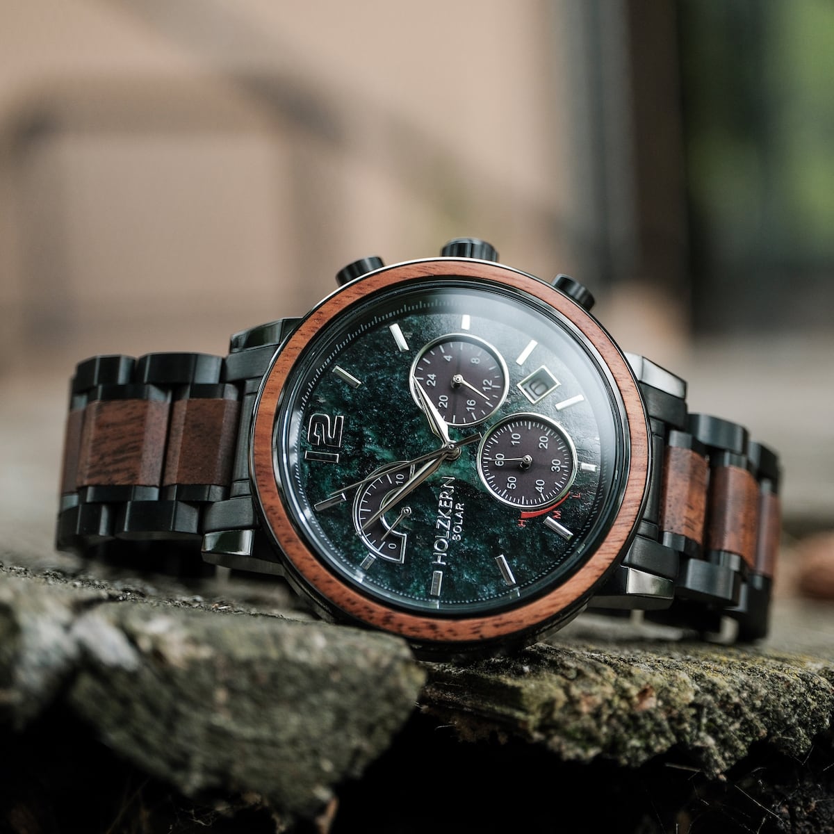 "Scattered" watch with marble and koa materials, featuring a sleek, sophisticated design.