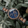 "Syntonize" watch, featuring a classic design with a sodalite blue face and walnut accents.